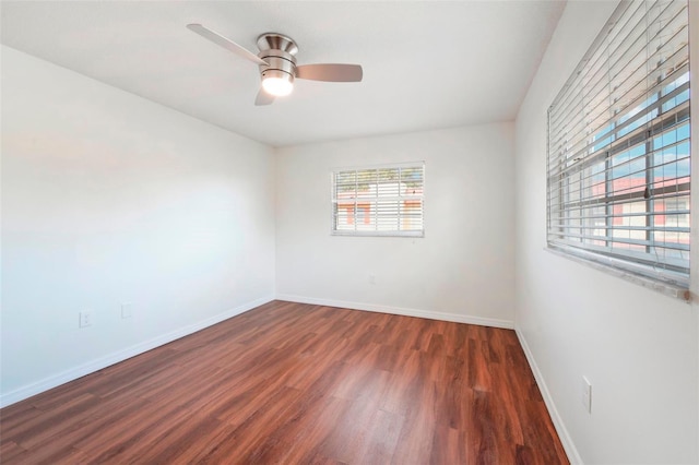 unfurnished room featuring dark hardwood / wood-style floors and ceiling fan