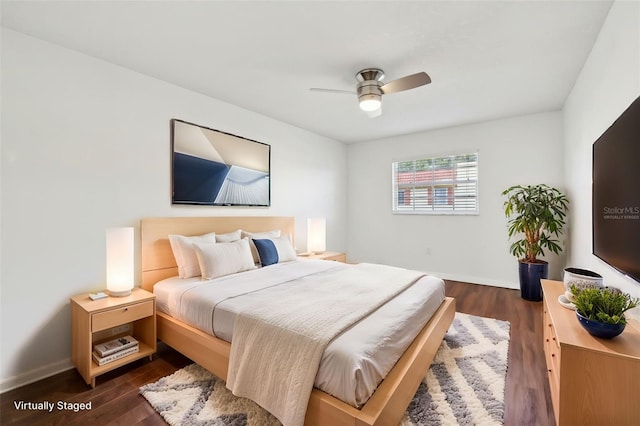 bedroom featuring dark hardwood / wood-style flooring and ceiling fan