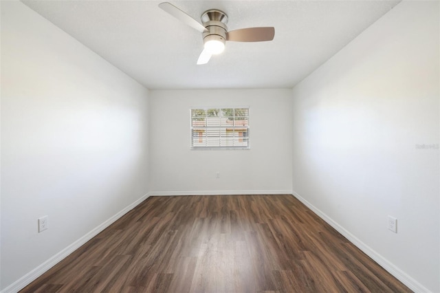 unfurnished room with ceiling fan and dark hardwood / wood-style flooring