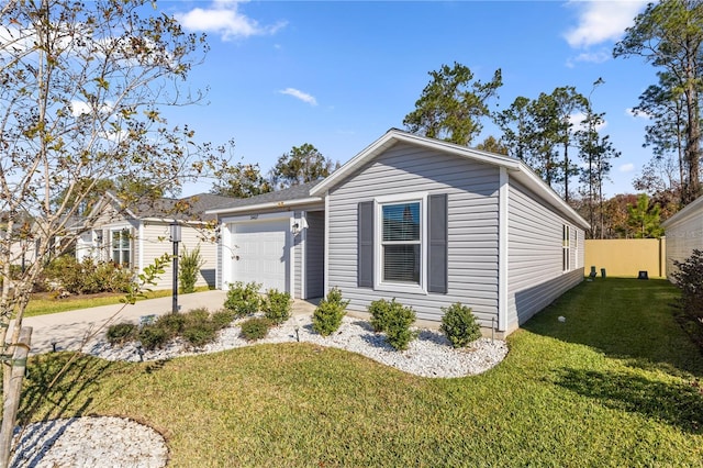 view of front of property with a front yard and a garage