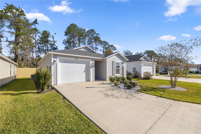 ranch-style house featuring a garage, a front yard, and central AC