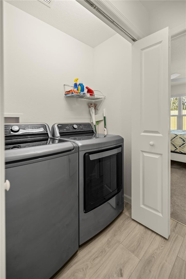 laundry room with washing machine and dryer