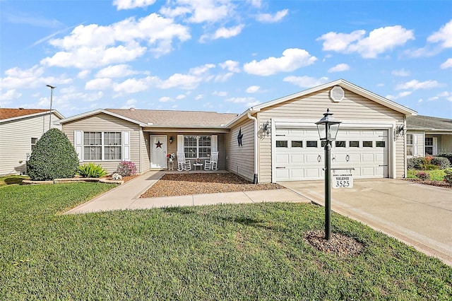 ranch-style house featuring a front yard and a garage