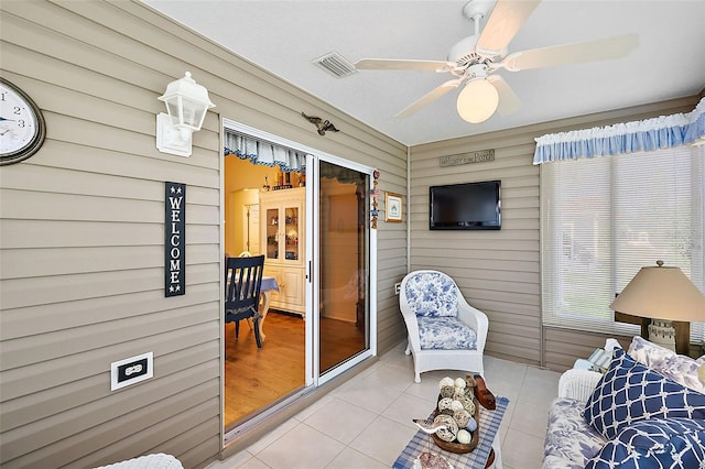 interior space featuring ceiling fan