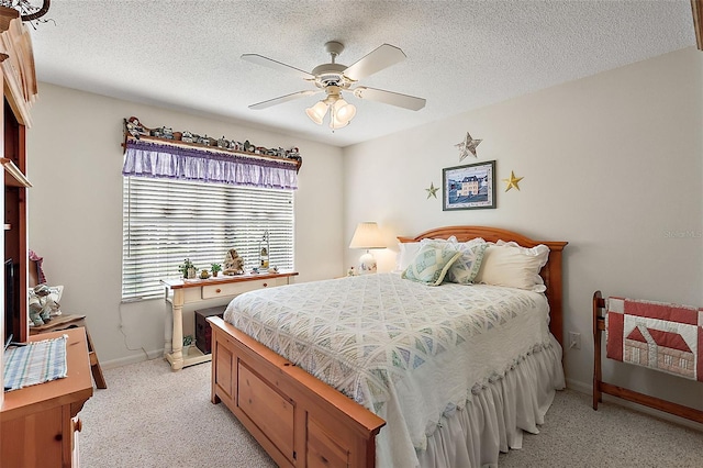 bedroom with a textured ceiling and ceiling fan