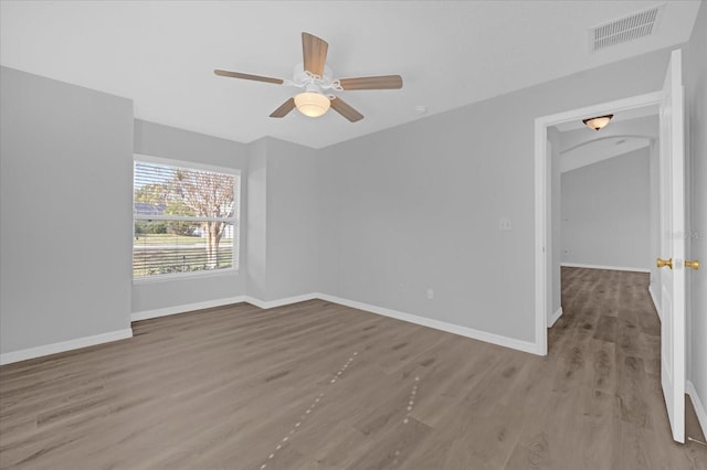 spare room featuring ceiling fan and hardwood / wood-style flooring