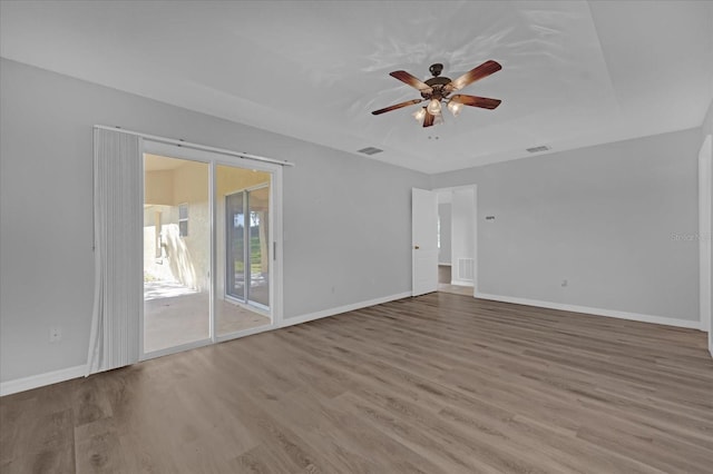 unfurnished room with hardwood / wood-style floors and ceiling fan