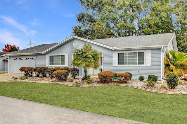 ranch-style home featuring a garage and a front yard