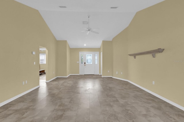 foyer entrance featuring high vaulted ceiling and ceiling fan