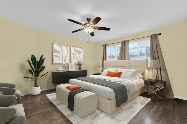 bedroom featuring dark hardwood / wood-style flooring and ceiling fan