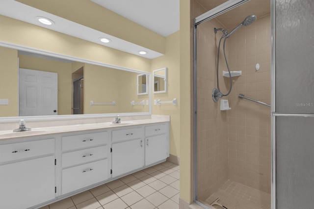 bathroom with vanity, tile patterned floors, and a shower with shower door