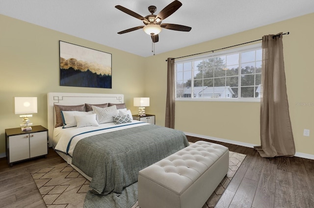 bedroom with hardwood / wood-style flooring and ceiling fan