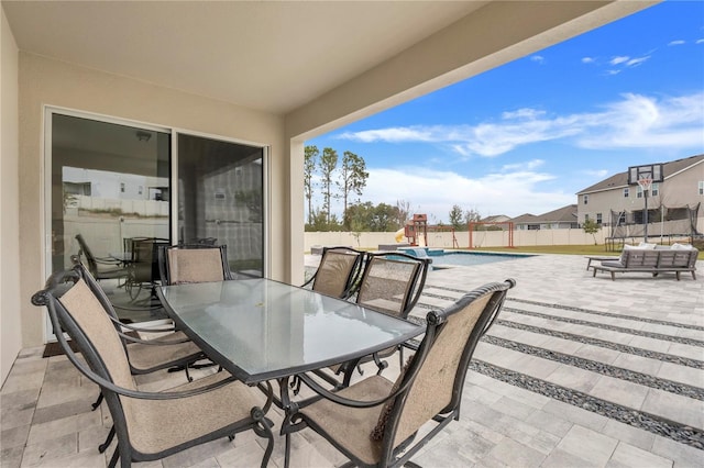 view of patio featuring a fenced in pool