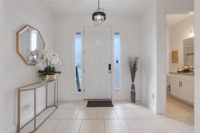 entrance foyer with light tile patterned floors