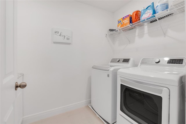 laundry area featuring washing machine and clothes dryer