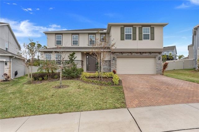 410 Cheeota Ct, Minneola, FL 34715 - view of front of property featuring stucco siding, decorative driveway, stone siding, and an attached garage