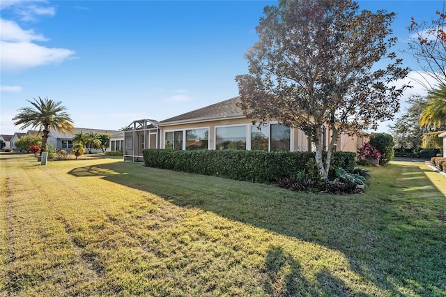 view of yard featuring a lanai