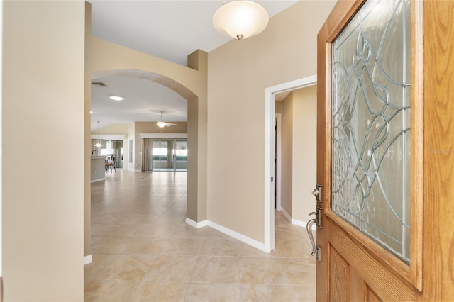 corridor with light tile patterned flooring