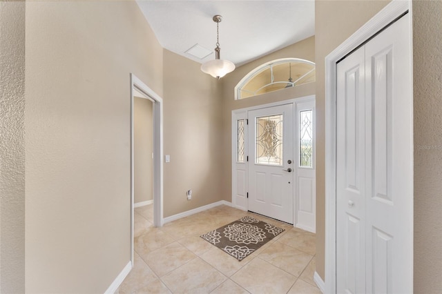 foyer entrance featuring light tile patterned flooring