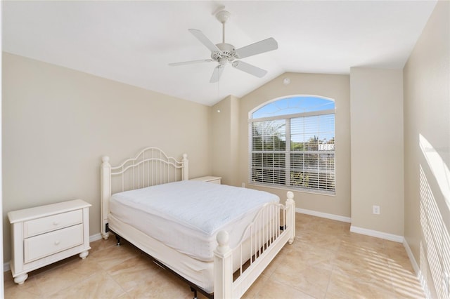 tiled bedroom featuring ceiling fan and lofted ceiling