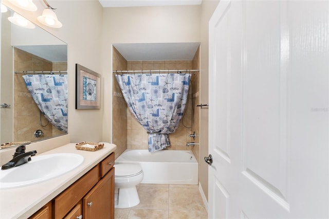 full bathroom featuring shower / bath combo with shower curtain, tile patterned flooring, vanity, and toilet