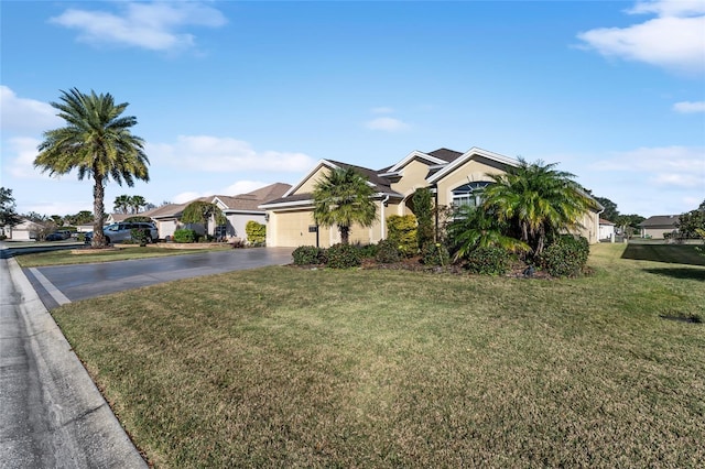 view of front of house featuring a garage and a front yard