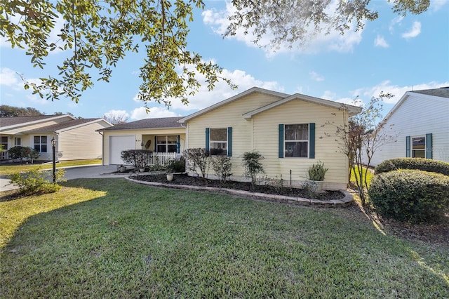 ranch-style home with a porch, a front yard, and a garage