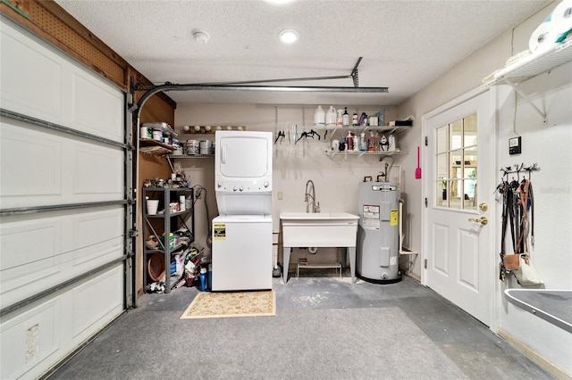 garage featuring electric water heater, stacked washing maching and dryer, and sink