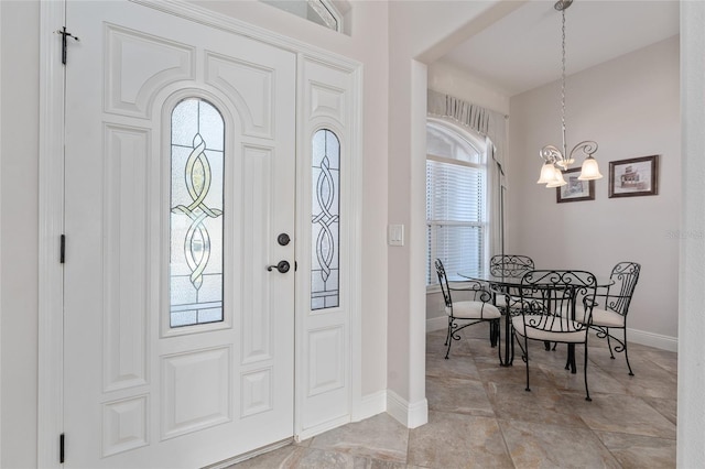 entrance foyer with a notable chandelier