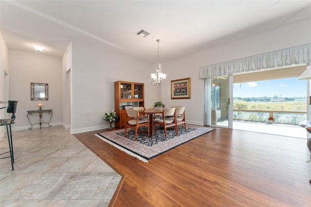 dining space with a notable chandelier