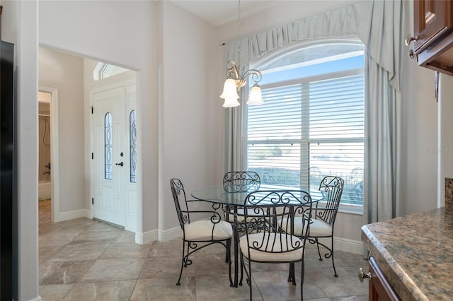 dining space with a chandelier