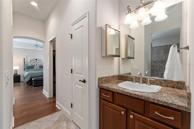 bathroom with ceiling fan and vanity