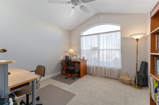 home office featuring carpet, ceiling fan, and lofted ceiling