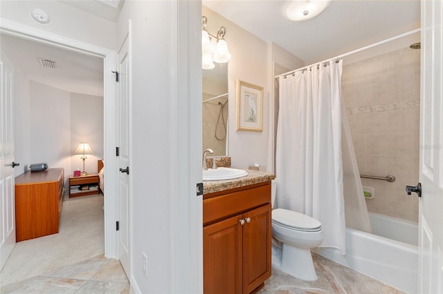 full bathroom with toilet, vanity, and shower / bath combo