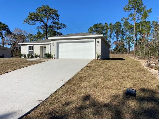 view of front of property with a garage and a front yard