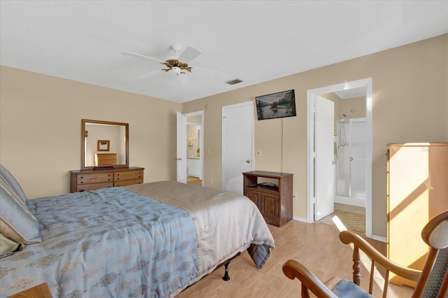 bedroom featuring ensuite bathroom, ceiling fan, and light hardwood / wood-style floors