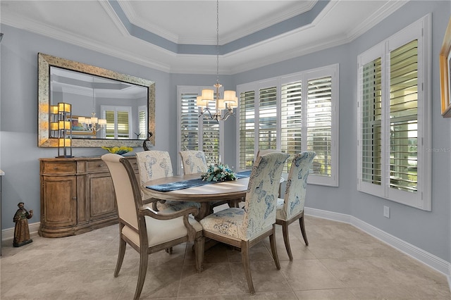 dining space featuring light tile patterned floors, crown molding, a raised ceiling, and a notable chandelier