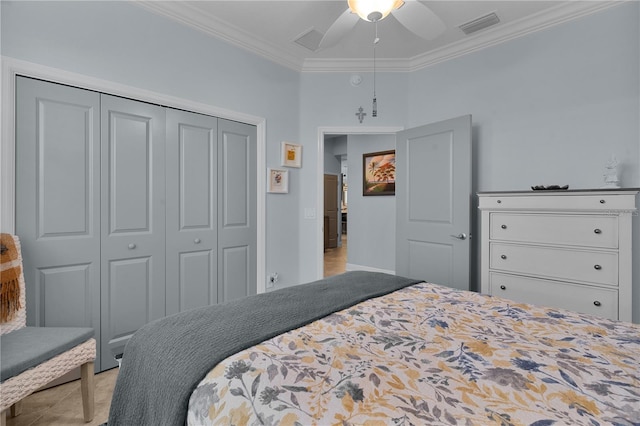 bedroom featuring ceiling fan, a closet, light tile patterned flooring, and ornamental molding