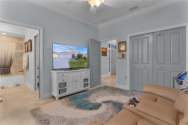 tiled living room with ceiling fan and ornamental molding