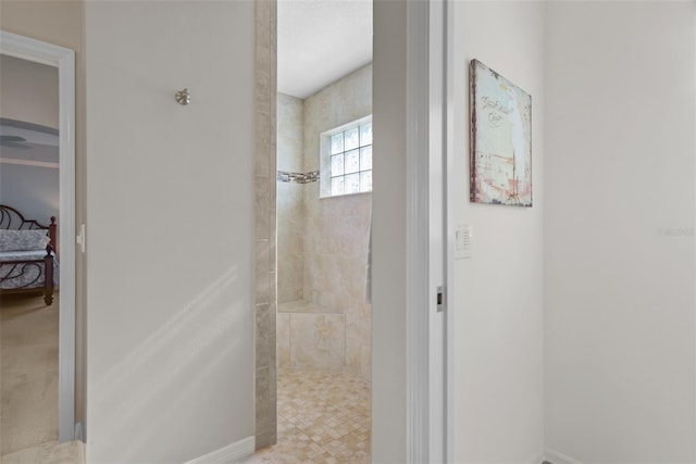 bathroom featuring tiled shower