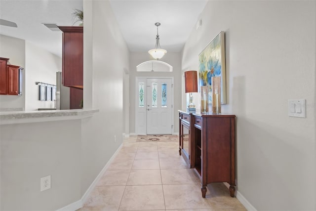 foyer entrance featuring light tile patterned floors