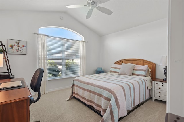 bedroom with ceiling fan, multiple windows, light carpet, and vaulted ceiling