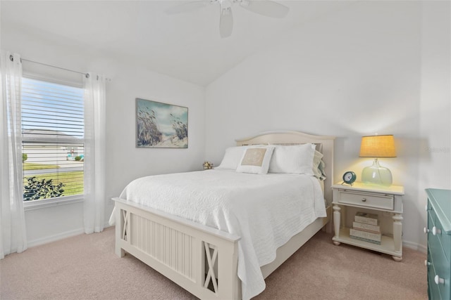 carpeted bedroom with ceiling fan and lofted ceiling