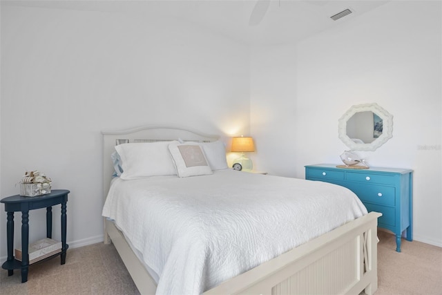 bedroom with ceiling fan and light colored carpet