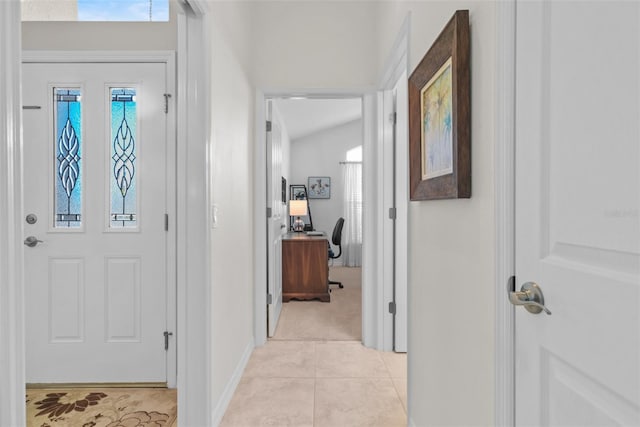 tiled entryway featuring plenty of natural light