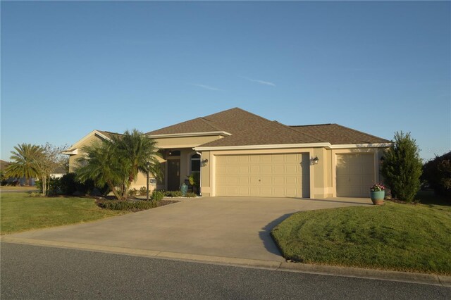 view of front facade with a garage and a front yard