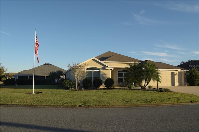 ranch-style house featuring a front lawn and a garage