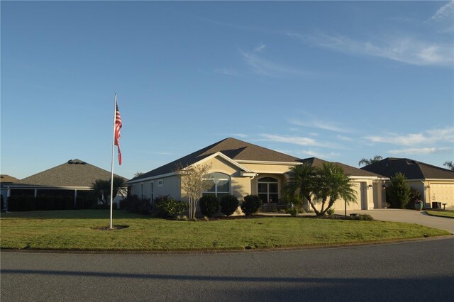 ranch-style home featuring a front yard and a garage