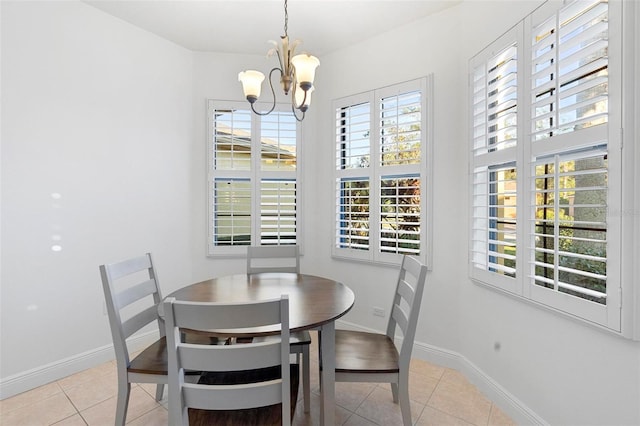 dining space with an inviting chandelier and light tile patterned flooring