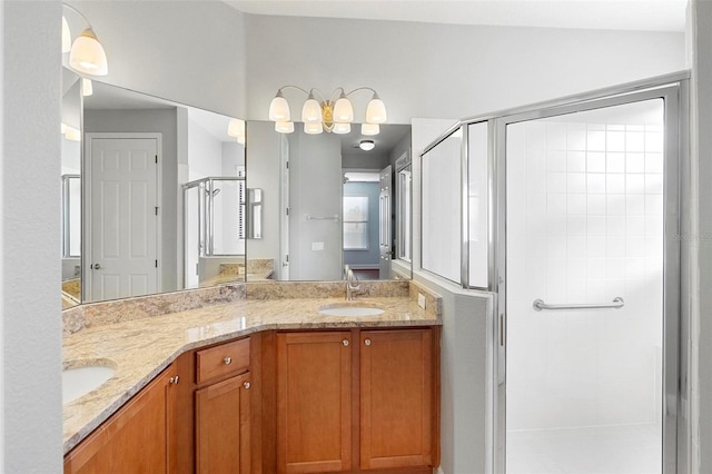 bathroom featuring vanity and an enclosed shower